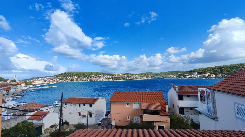 a view of a town and a body of water at Apartmany Tisno Nikola in Tisno