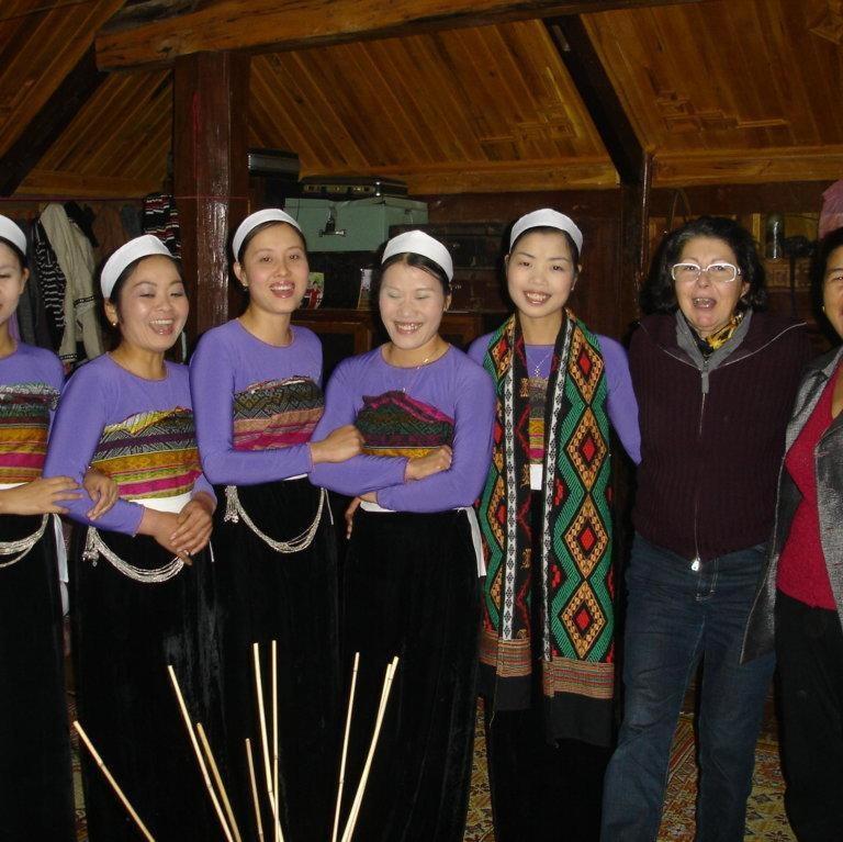 a group of women are posing for a picture at An' Home Mai Chau in Mai Chau
