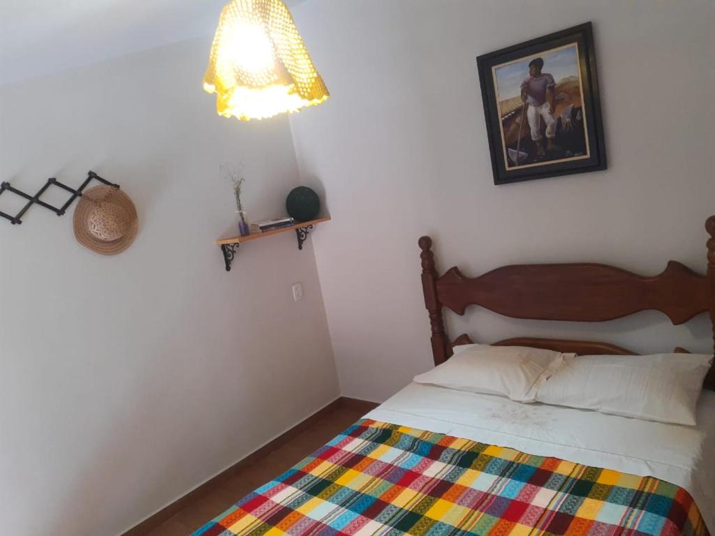 Ένα ή περισσότερα κρεβάτια σε δωμάτιο στο Serra da Capela