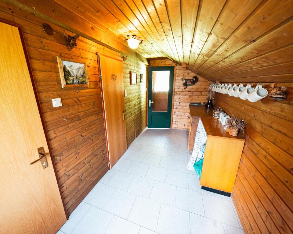 a hallway of a house with a wooden ceiling at Almhütte am Seeberg in Brandhof