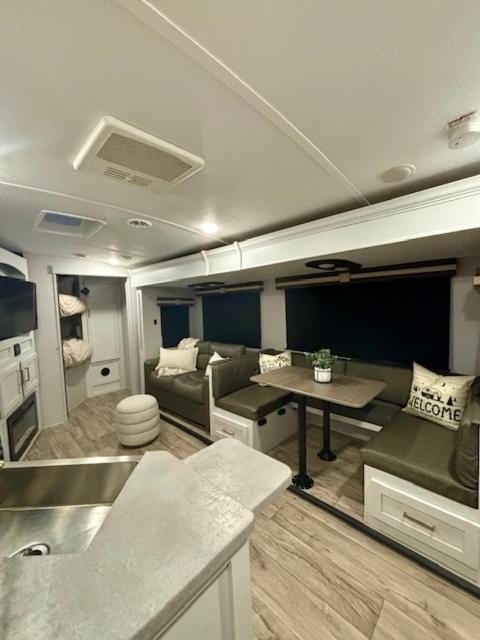 a living room with a couch and a table in a trailer at Astoria in Round Top