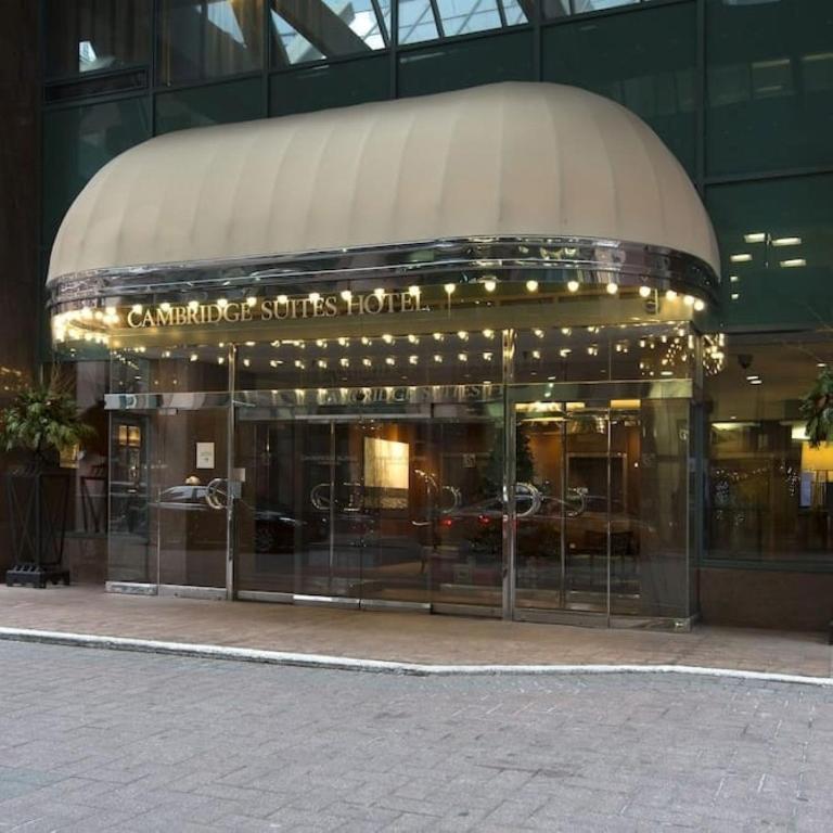 a store front of a building with glass doors at Cambridge Suites Toronto in Toronto