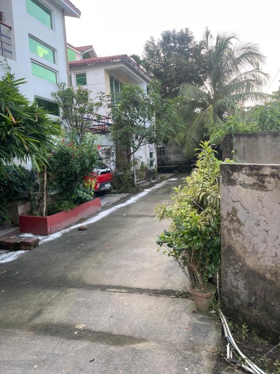 an empty parking lot in front of a house at Holiday villa in Kolkata