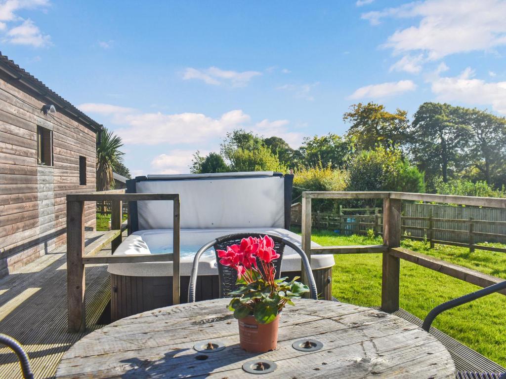 a patio with a table and a chair on a deck at Croft - Uk50042 in Clitheroe