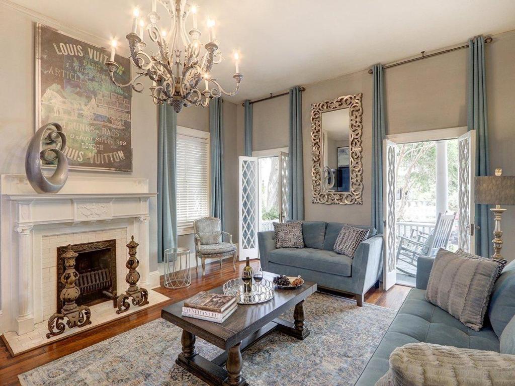 a living room with a couch and a fireplace at Southern Hall Lower in Savannah
