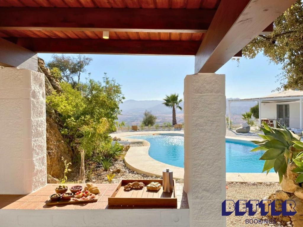 a view of a pool from the patio of a house at Alora Private Villa - Pool & 360 Mountain Views in Alora