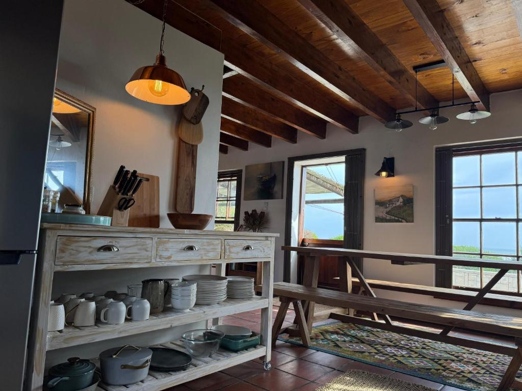 a kitchen with a counter with dishes on it at San Ma Lou in Paternoster