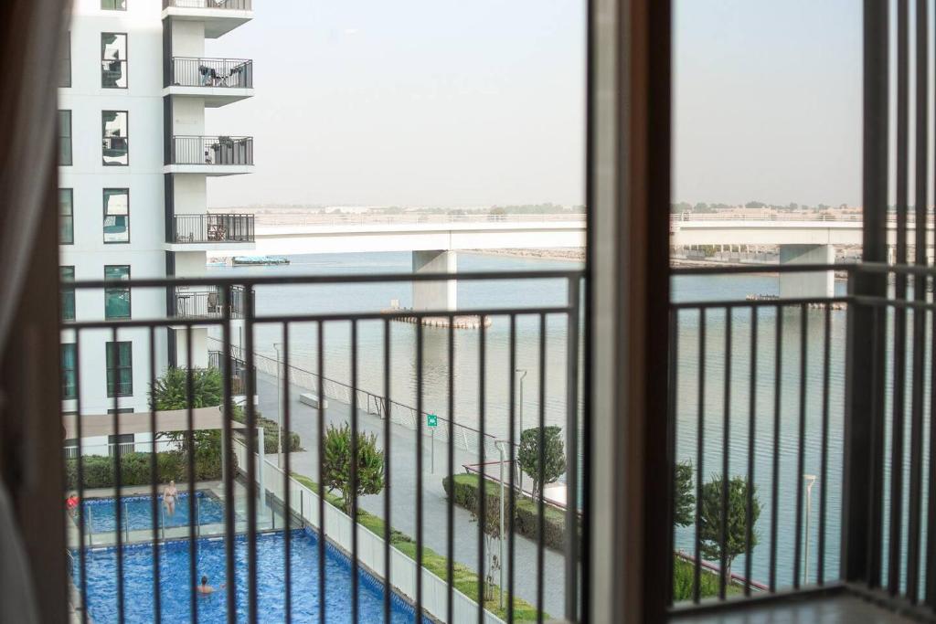 a view from a hotel room window of a swimming pool at Seabreeze Studio Yas Island in Abu Dhabi