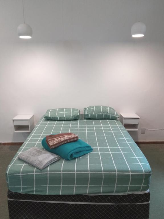 Una cama o camas en una habitación de Apartamento 501