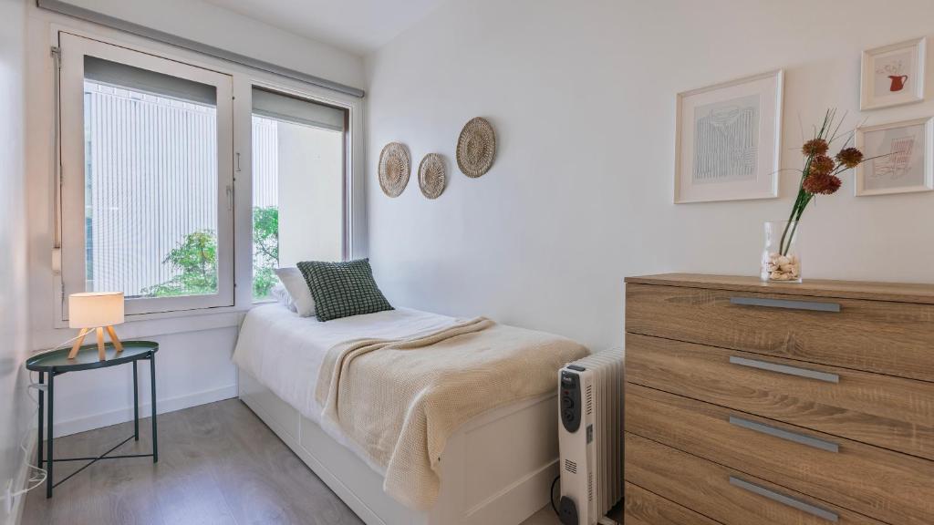 Una cama o camas en una habitación de 1BDR Tróia Beach House by LovelyStay