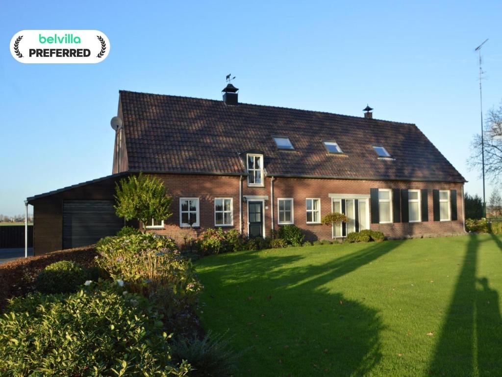 an old brick house with a large yard at Farmhouse in Elsendorp near Forest Trails in Elsendorp