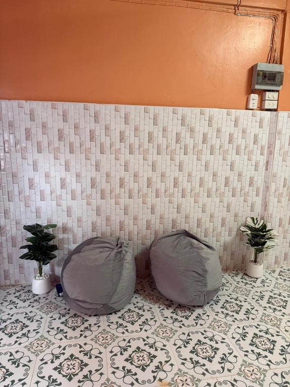 a room with two bean bags and two potted plants at best 148 train staytion in Godown