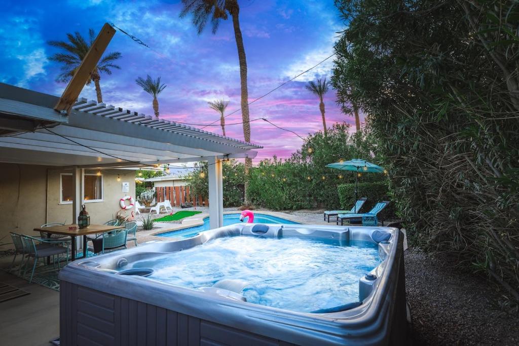 a hot tub in the backyard of a house at Saltwater Pool - HotTub - Games - Good Vibes Only! in Indio