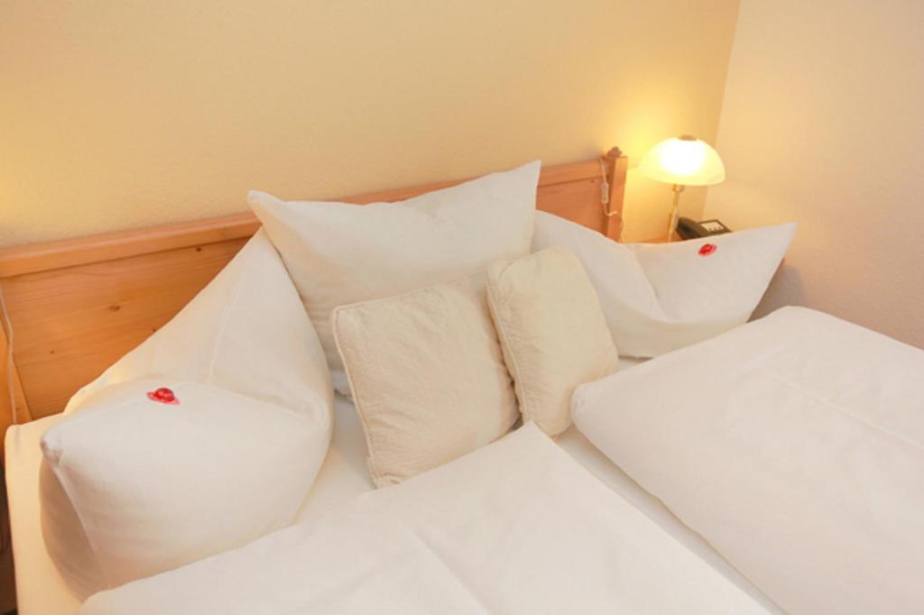 Postel nebo postele na pokoji v ubytování Hotel in der Mühle