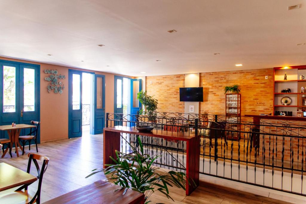 a room with a table and chairs and a dining room at Vila de Cunha in Cunha