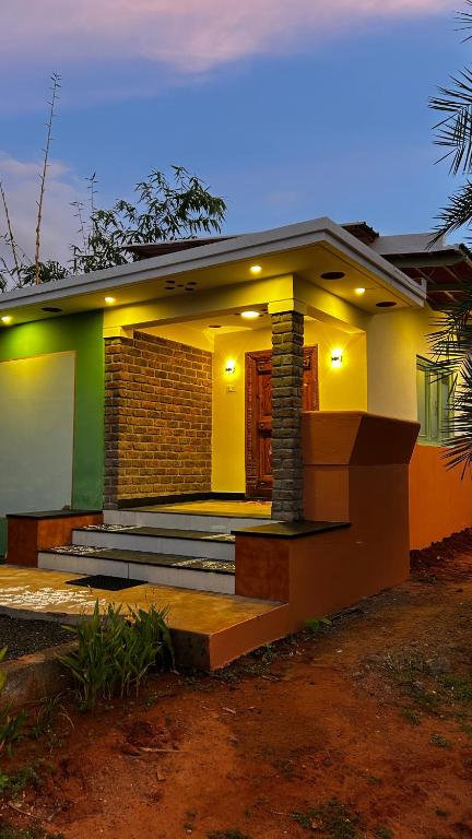 a small house with a pathway leading to it at Pk Villa in Auroville