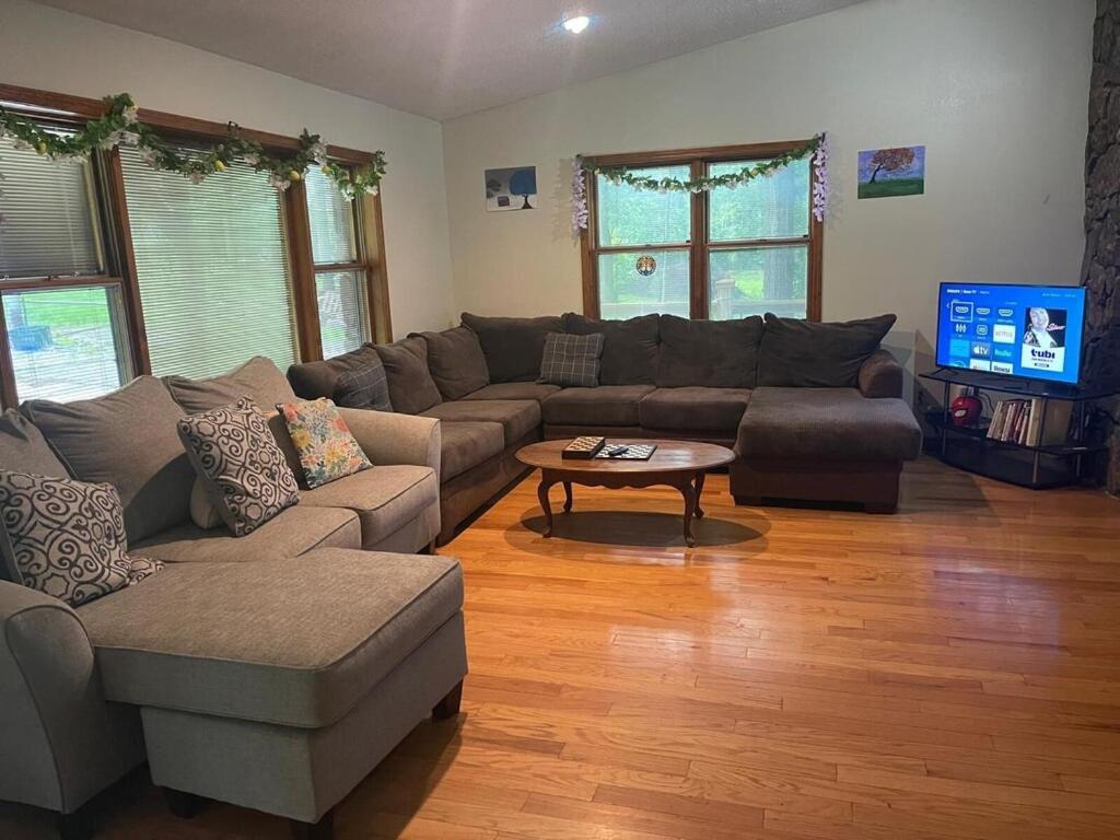 a living room with a couch and a coffee table at Peaceful Resort Retreat in Springfield