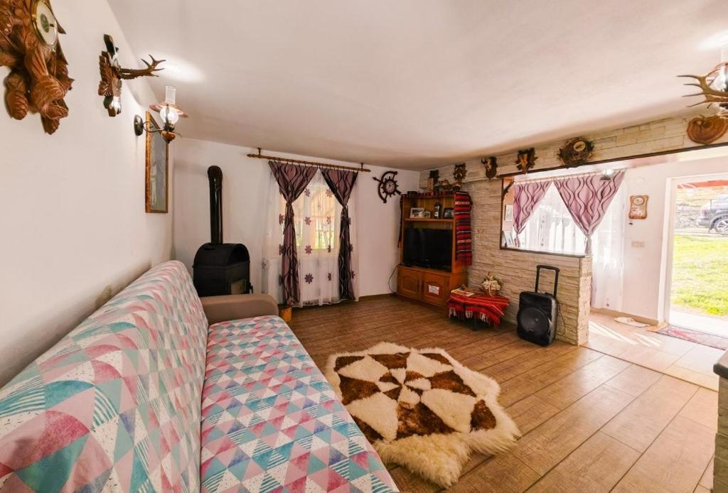 Giường trong phòng chung tại Cabana lui Foardă