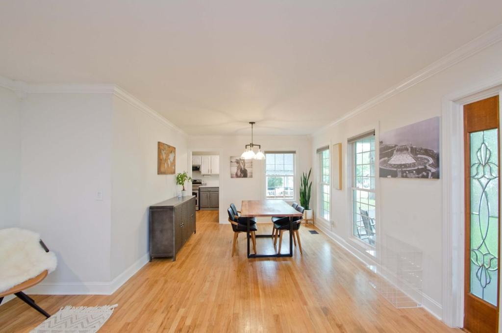 an empty living room with a table and chairs at Medical District 3bd 3bth Bungalow in Decatur