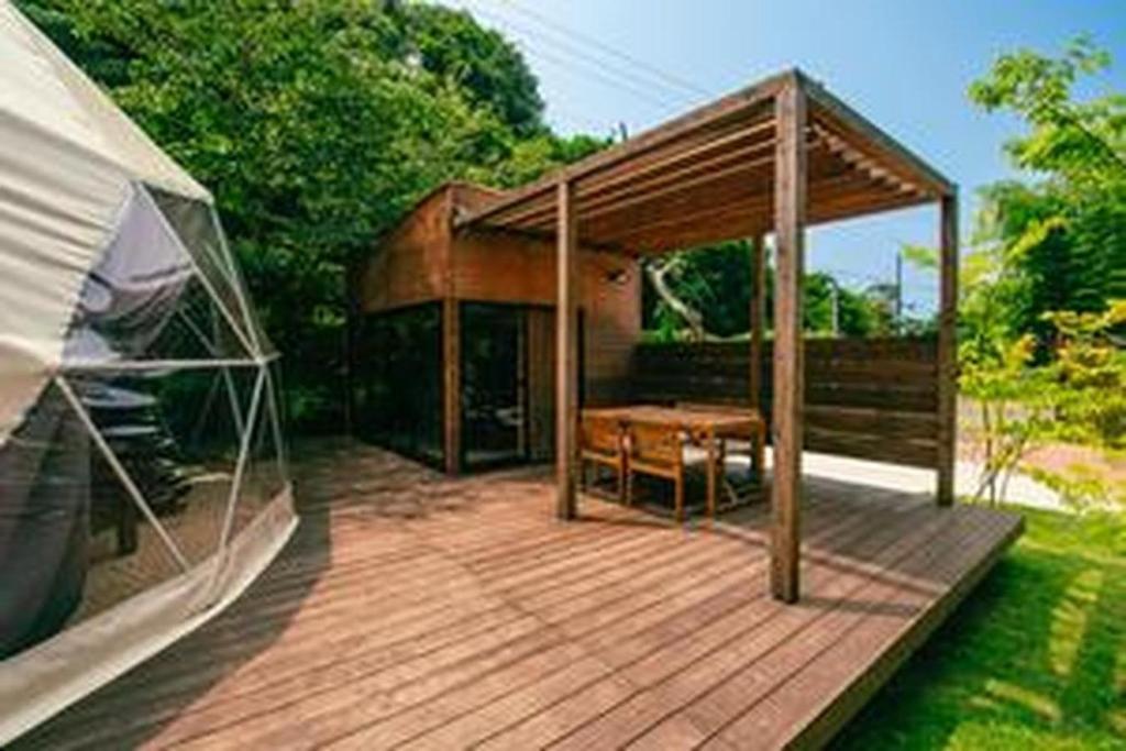 a pavilion with a table and a bench on a deck at Yura Green - Vacation STAY 73979v in Yura