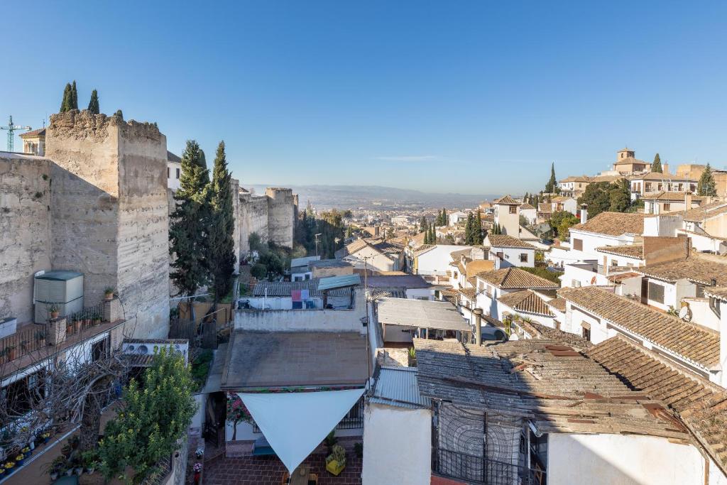 an aerial view of a city with buildings at Apartamentos - PinkSparrow - in Granada