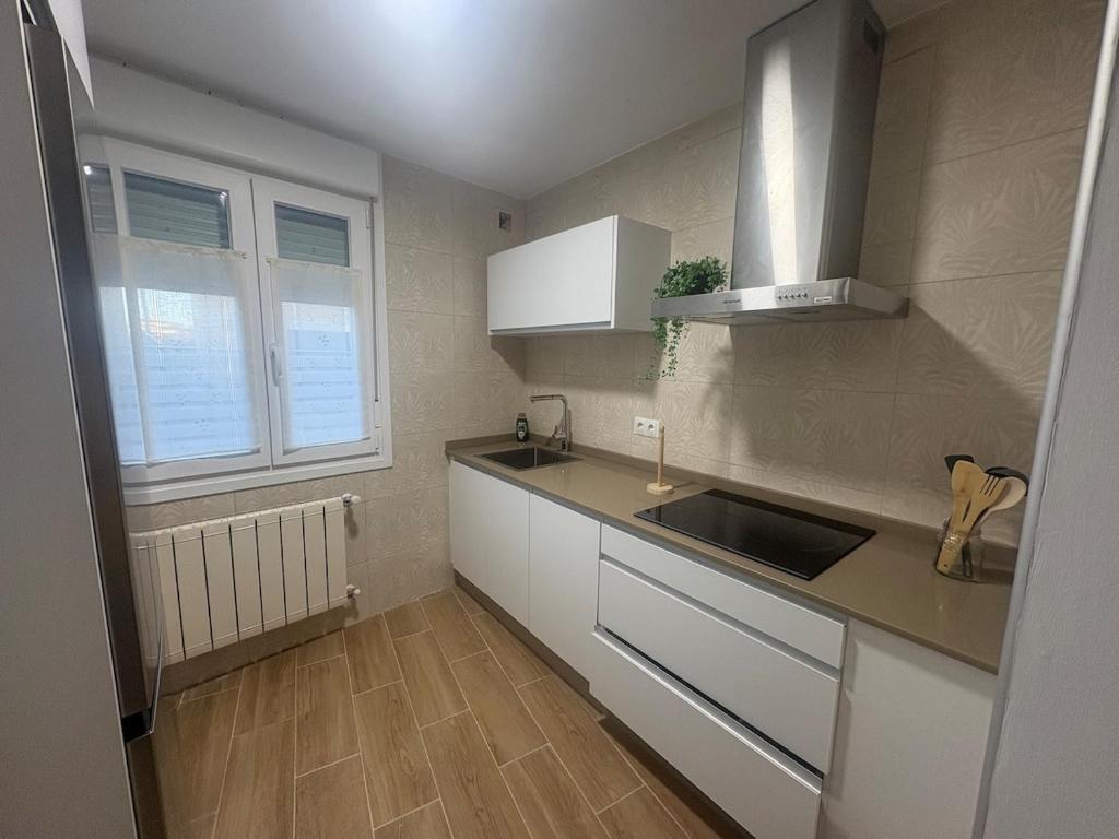 a kitchen with a sink and a counter top at El pisito de Cris y Mia in Ponferrada