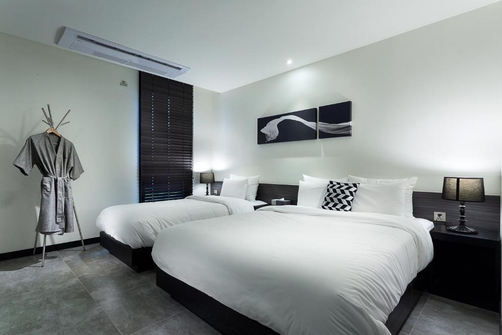 Postel nebo postele na pokoji v ubytování Hotel Sienna