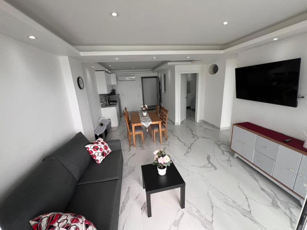 a living room with a couch and a table at Boca Beach 504, Boca Chica in Boca Chica