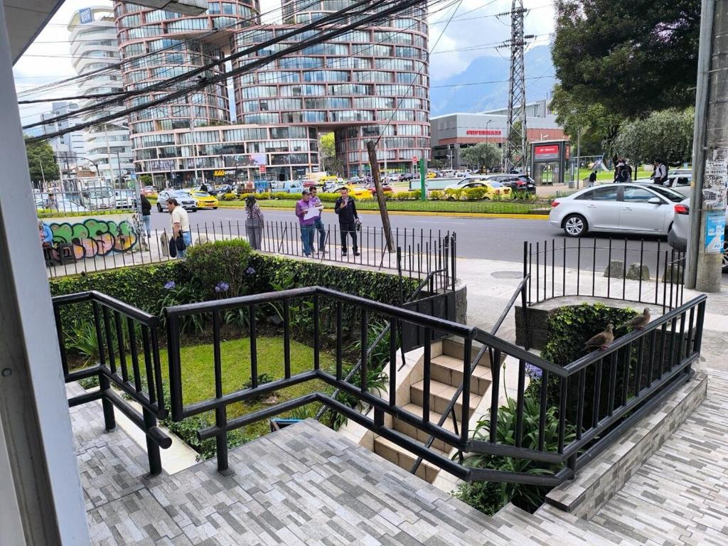 a group of people walking on a city street at 402 El Jardín Apartamento La Carolina Quito in Quito