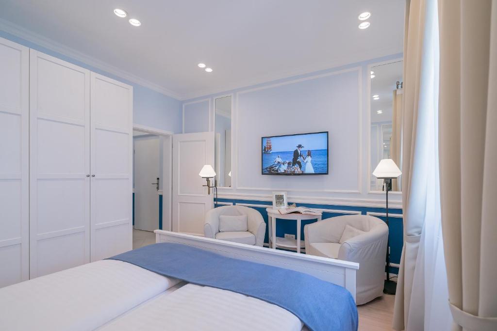 Ένα ή περισσότερα κρεβάτια σε δωμάτιο στο Revelton Suites Karlovy Vary