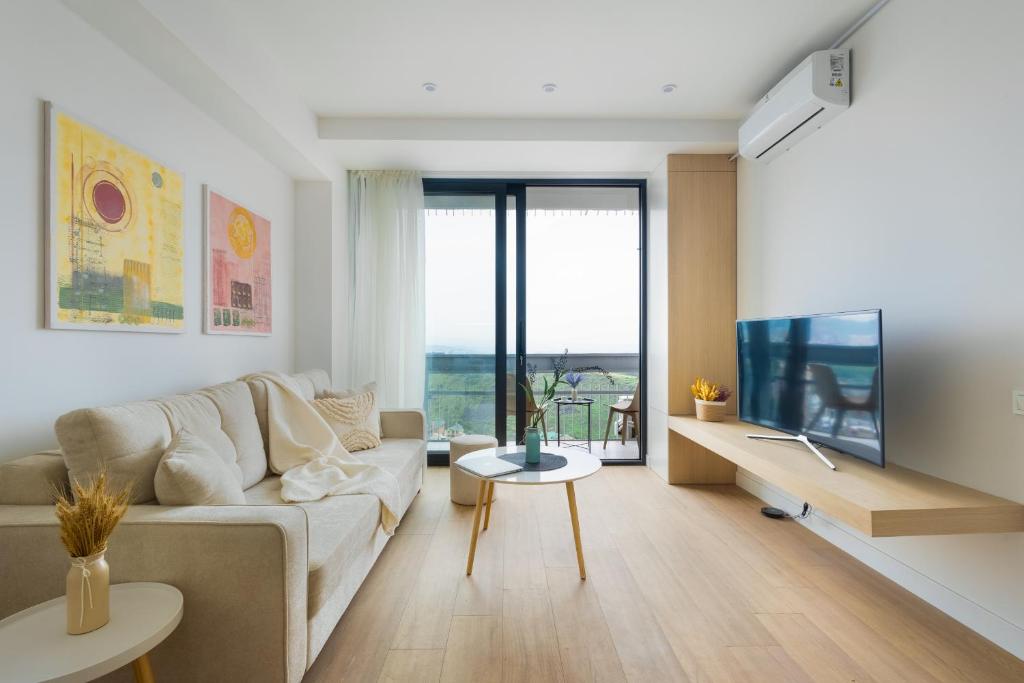 Μια τηλεόραση ή/και κέντρο ψυχαγωγίας στο hotelise l Pastel Apartment