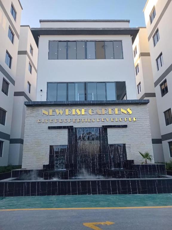 a building with a fountain in front of a building at Imani Homes in Nairobi