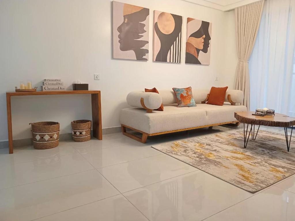 a living room with a couch and a table at Imani Homes in Nairobi