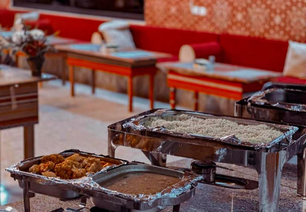 a table with a buffet with food on it at Sama Wadi Rum Luxury Camp in Wadi Rum
