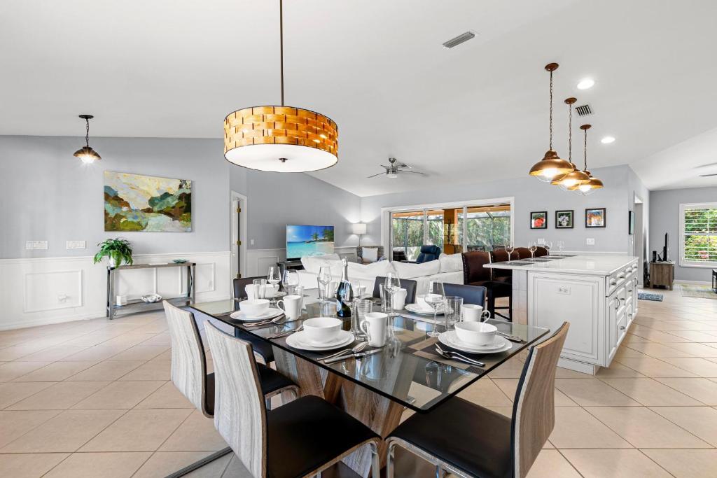 a dining room and living room with a dining table at Barfield Bay Tuckaway in Rookery Island