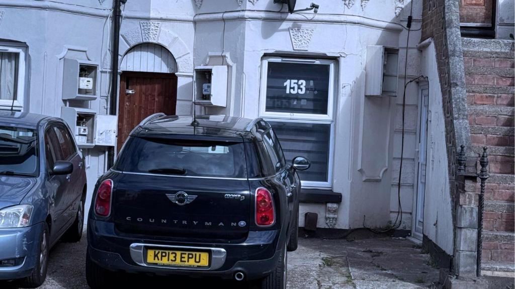 a black car parked in front of a building at House for 4 in chatham with free driveway Parking in Chatham
