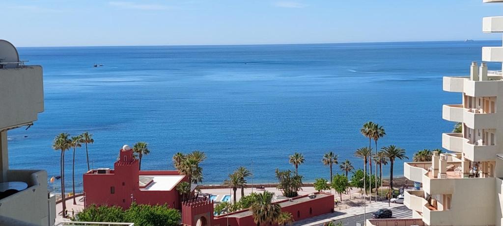 a view of the ocean from a building at Benal Beach Vibe in Benalmádena