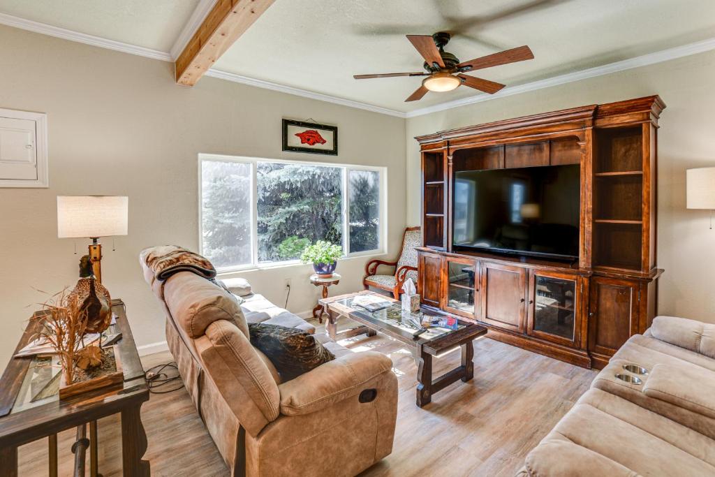 a living room with a couch and a tv at Walk to River Oacoma Home with Dog-Friendly Yard! in Oacoma