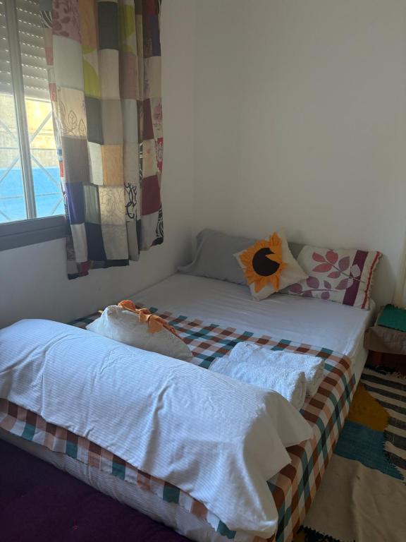 Ένα ή περισσότερα κρεβάτια σε δωμάτιο στο Studio coeur tanger