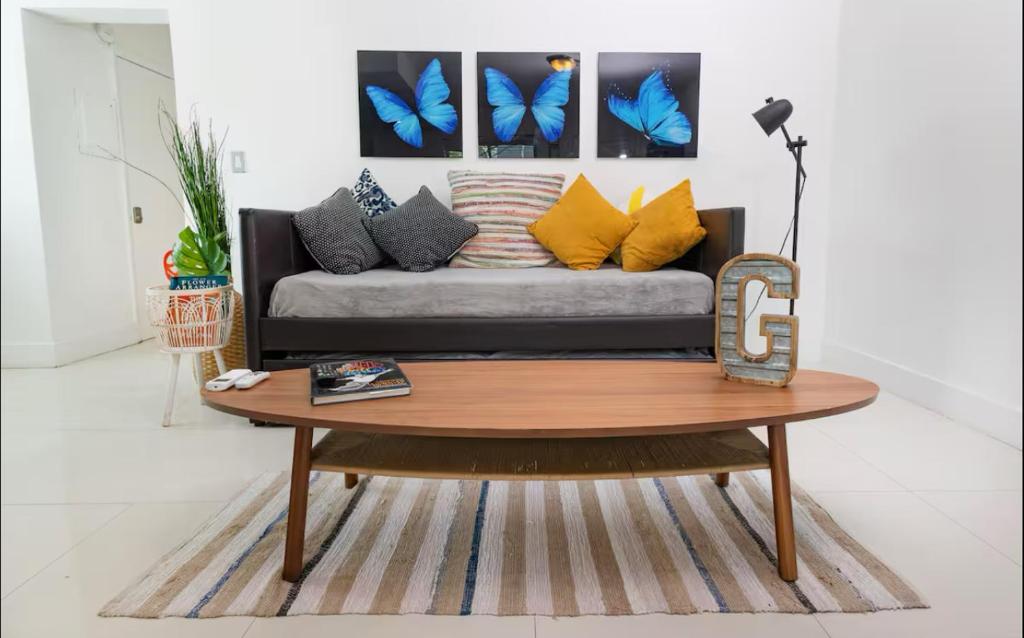 a living room with a couch and a coffee table at GroveO6 10 minutes from the Beach in Miami