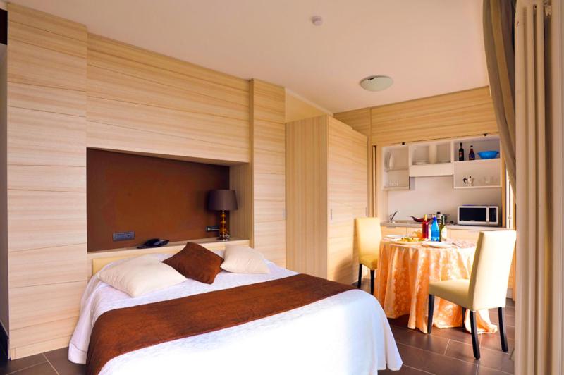 Posteľ alebo postele v izbe v ubytovaní Excelsior Hotel E Appartamenti