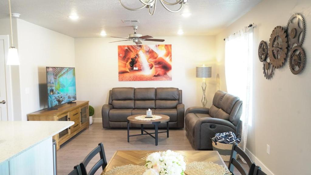 a living room with a couch and a table at Red Rock Retreat Your Home Away From Home in Kanab