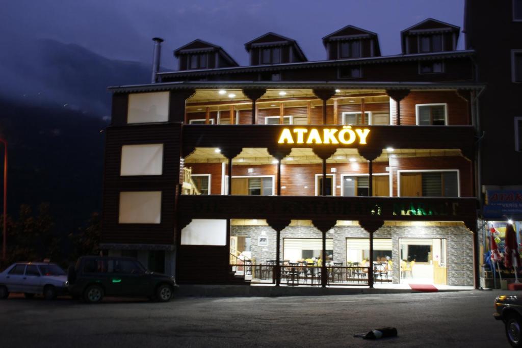 a building with an atrium sign on it at night at Ataköy Otel Cafe Restaurant in Çaykara