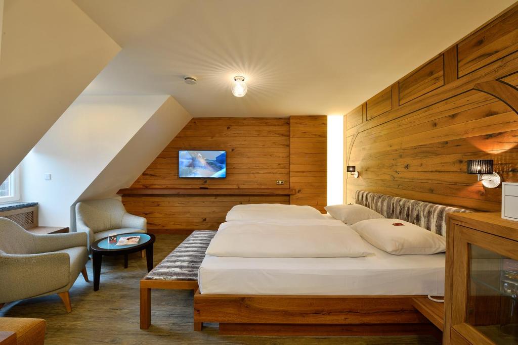 Postel nebo postele na pokoji v ubytování Hotel Torbräu