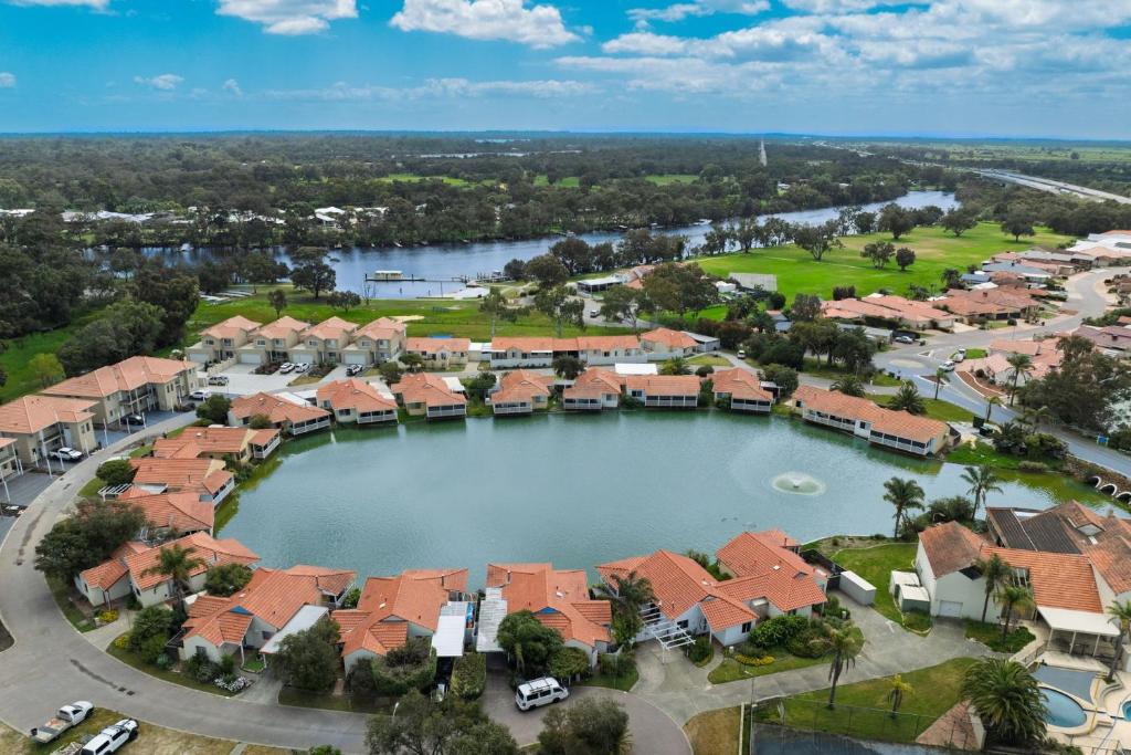 an aerial view of a suburb with a large lake at The Whitehouse - South Yunderup in South Yunderup