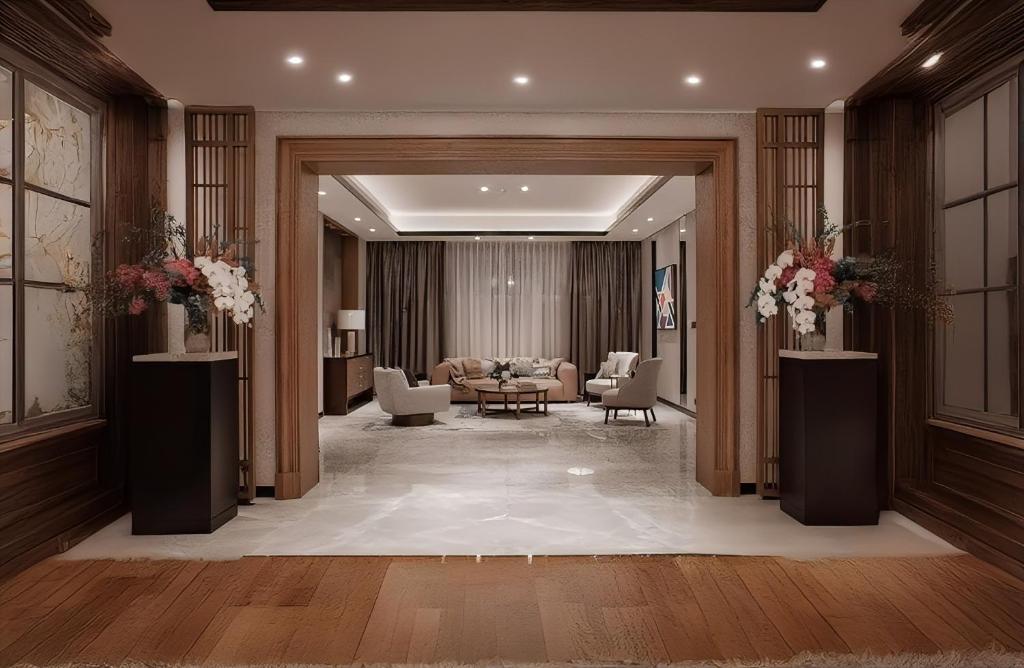 a lobby of a hotel with a waiting room at Arvesto Lux Jakarta in Jakarta