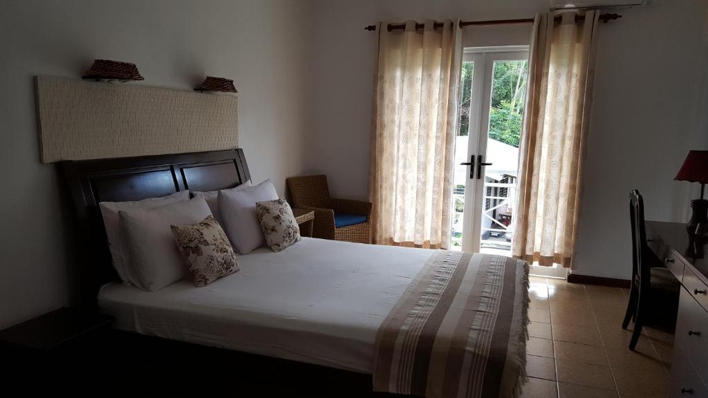Postel nebo postele na pokoji v ubytování Villa Kayola - Self Catering