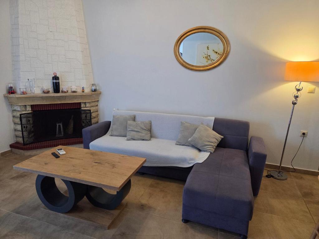 a living room with a couch and a coffee table at center apartments in Lefkada