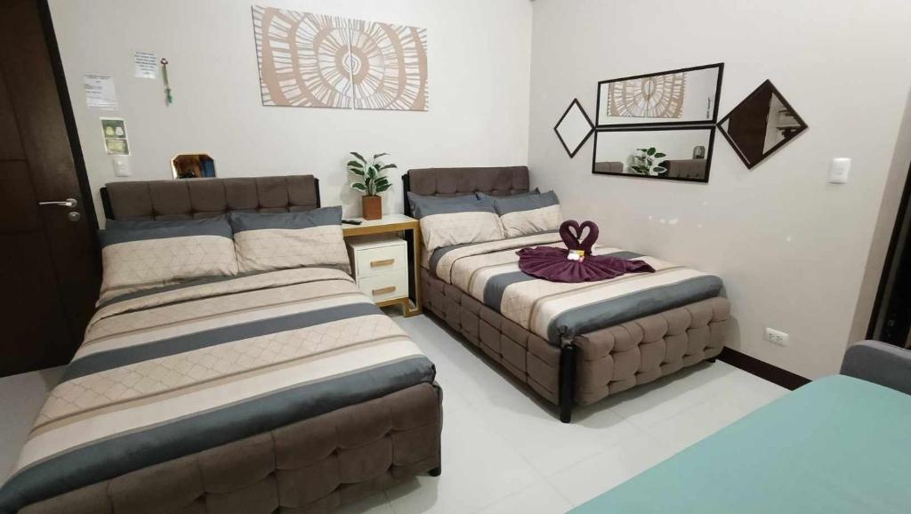 Ένα ή περισσότερα κρεβάτια σε δωμάτιο στο Manila Airport Hub near NAIA T3 -101 Newport Boulevard