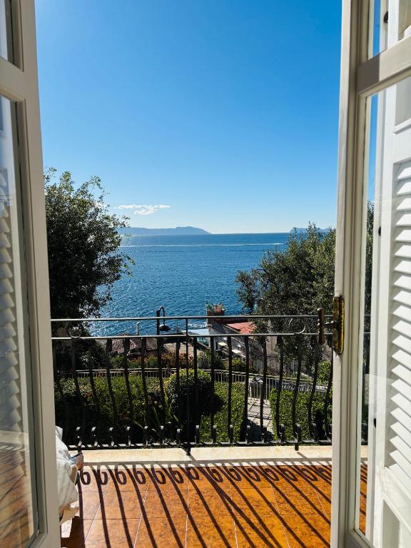 a view of the ocean from a balcony at Charming Posillipo Sea View Ibiscus House in Naples
